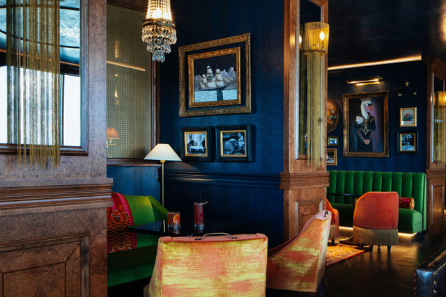 A photo of a highly decorative room. Tiger & Peacock.